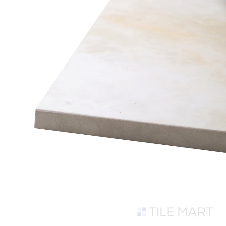 A corner shot of the Luxury Kristalus Cream 24x48 polished porcelain tile highlights its soft cream tones and reflective surface, adding warmth and sophistication to large spaces.