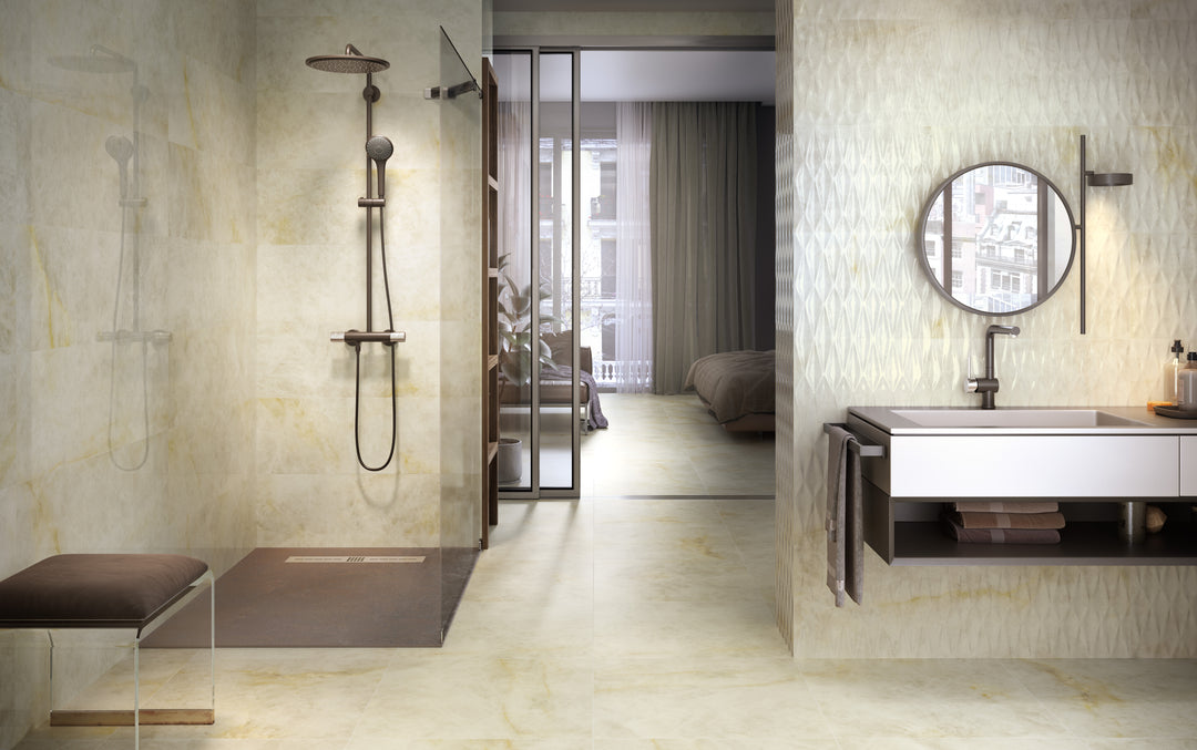 A serene environment accented by Luxury Kristalus Cream 24X48 polished porcelain, delivering warmth with a touch of opulence.