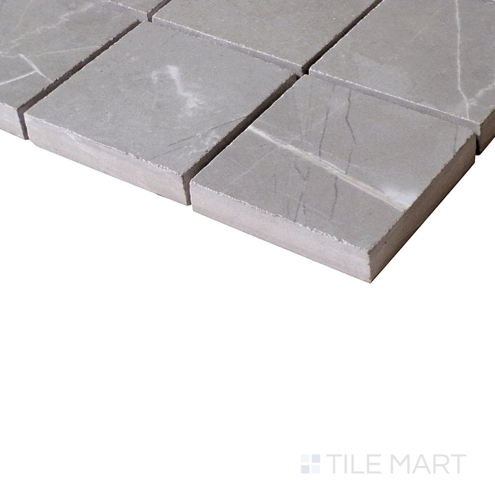 Close-up angle of Luxury Amani Grey 2" Square Polished Porcelain Mosaic, highlighting its subtle grey tones and sleek polish.