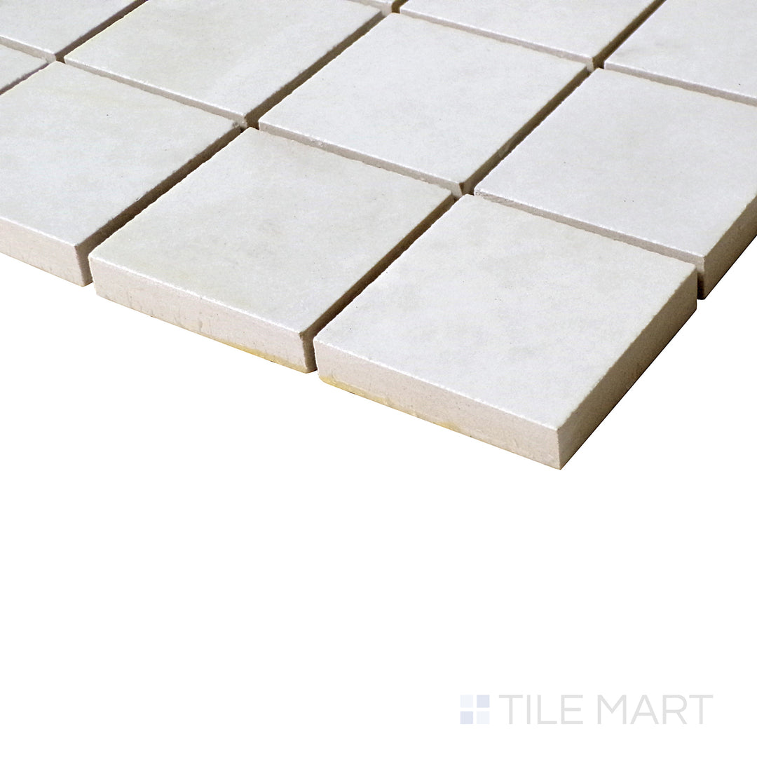 Angled perspective of Luxury Kristalus White 2" Square Polished Porcelain Mosaic, reflecting its clean design and glossy texture.