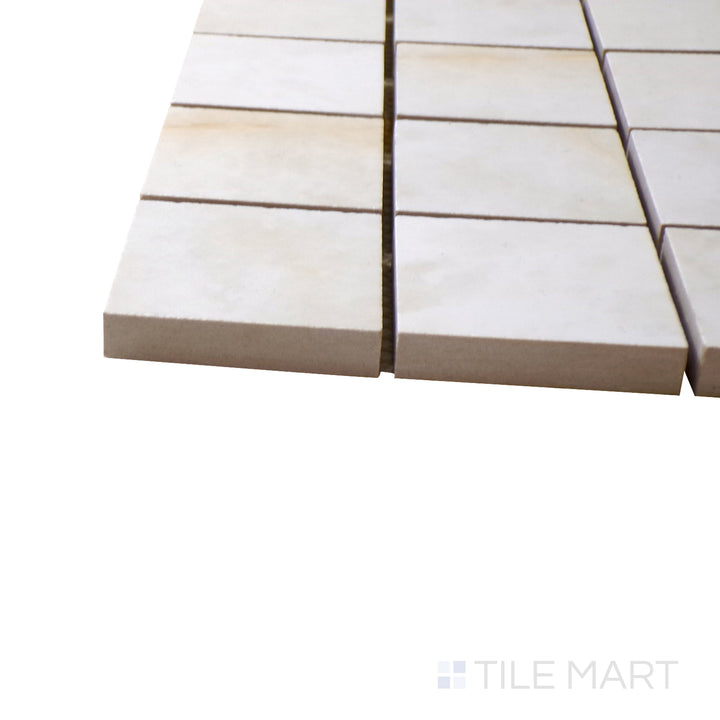 A corner shot of the Luxury Kristalus Cream 2" square polished porcelain mosaic tile highlights its soft cream tones and smooth polished surface, perfect for refined and neutral design schemes.