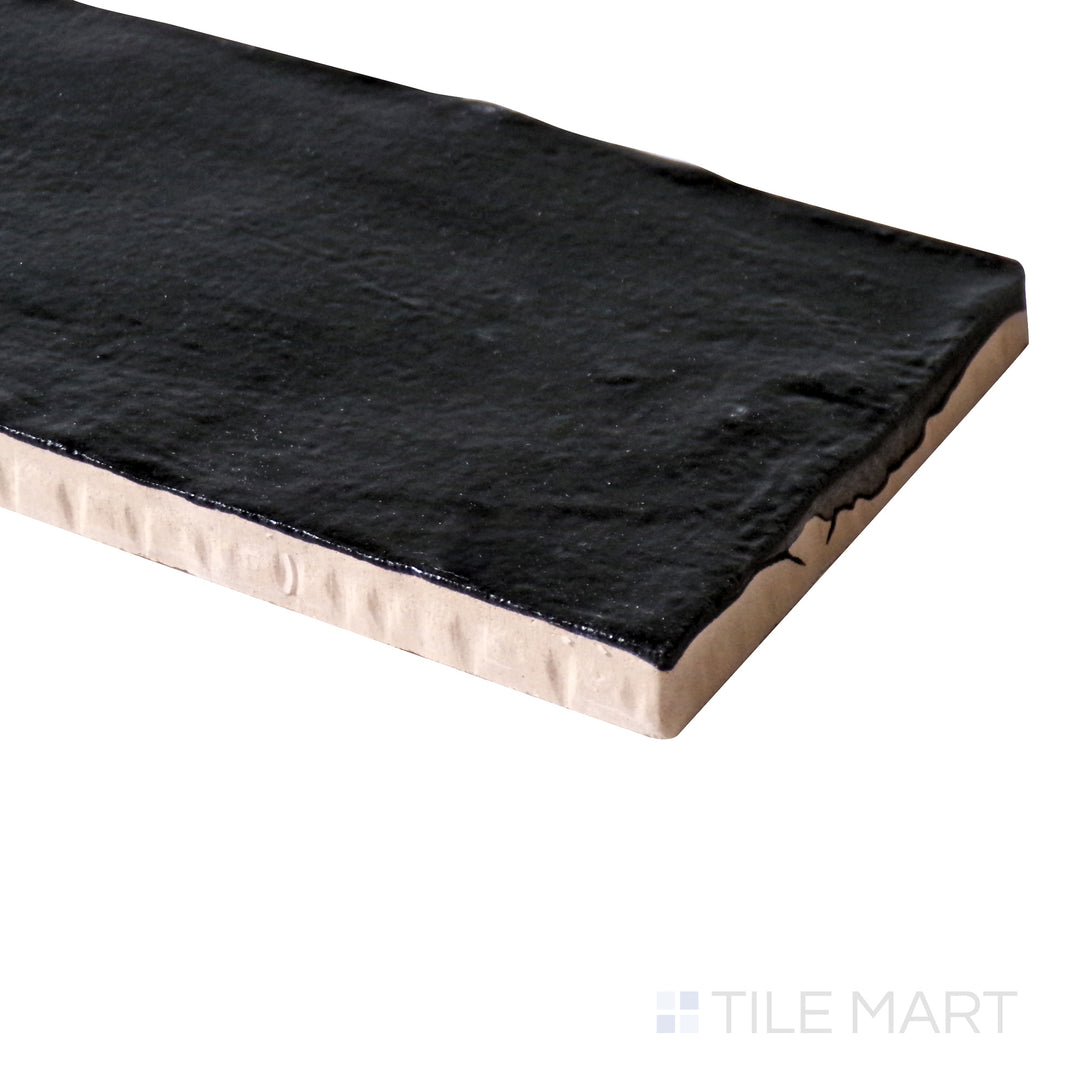 Angled close-up of Mallorca Black 2X8 Matte Ceramic, showcasing its deep black tone and soft matte surface.