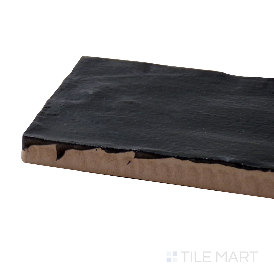 A corner shot of the Mallorca Black 2x8 matte ceramic tile highlights its deep black hue and smooth matte surface, creating a bold and timeless look.