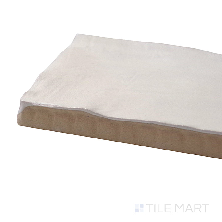 A corner perspective of the Mallorca Cream 2x8 matte ceramic tile emphasizes its soft cream tone and velvety matte finish, delivering a warm and inviting ambiance.