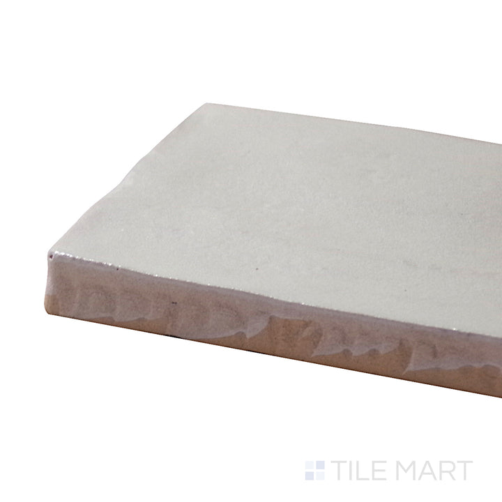 A corner shot of the Mallorca Green 2x8 matte ceramic tile highlights its muted green hue and matte surface, adding a natural and refreshing touch.