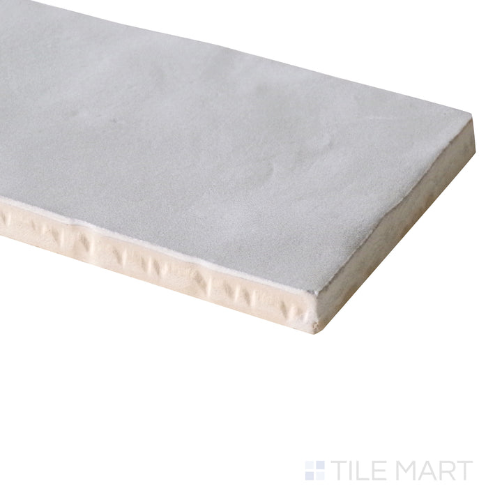 Side angle emphasizing the cool grey shade and muted matte surface of Mallorca Grey 2X8 Matte Ceramic.