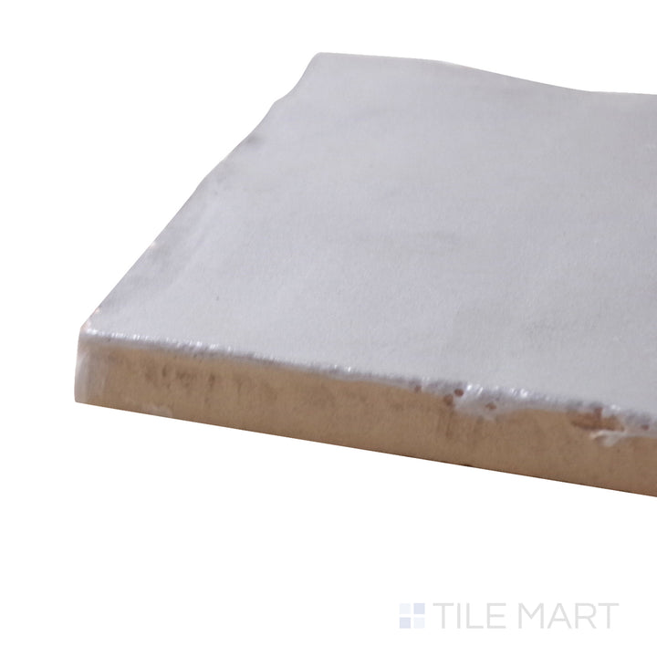 Captured from a corner angle, the Mallorca Grey 2x8 matte ceramic tile showcases its neutral gray tone and smooth matte texture, making it a versatile choice for modern interiors.