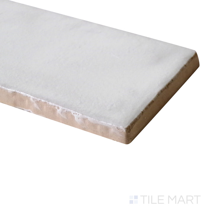 Close-up angle shot revealing the crisp white color and smooth matte texture of Mallorca White 2X8 Matte Ceramic.