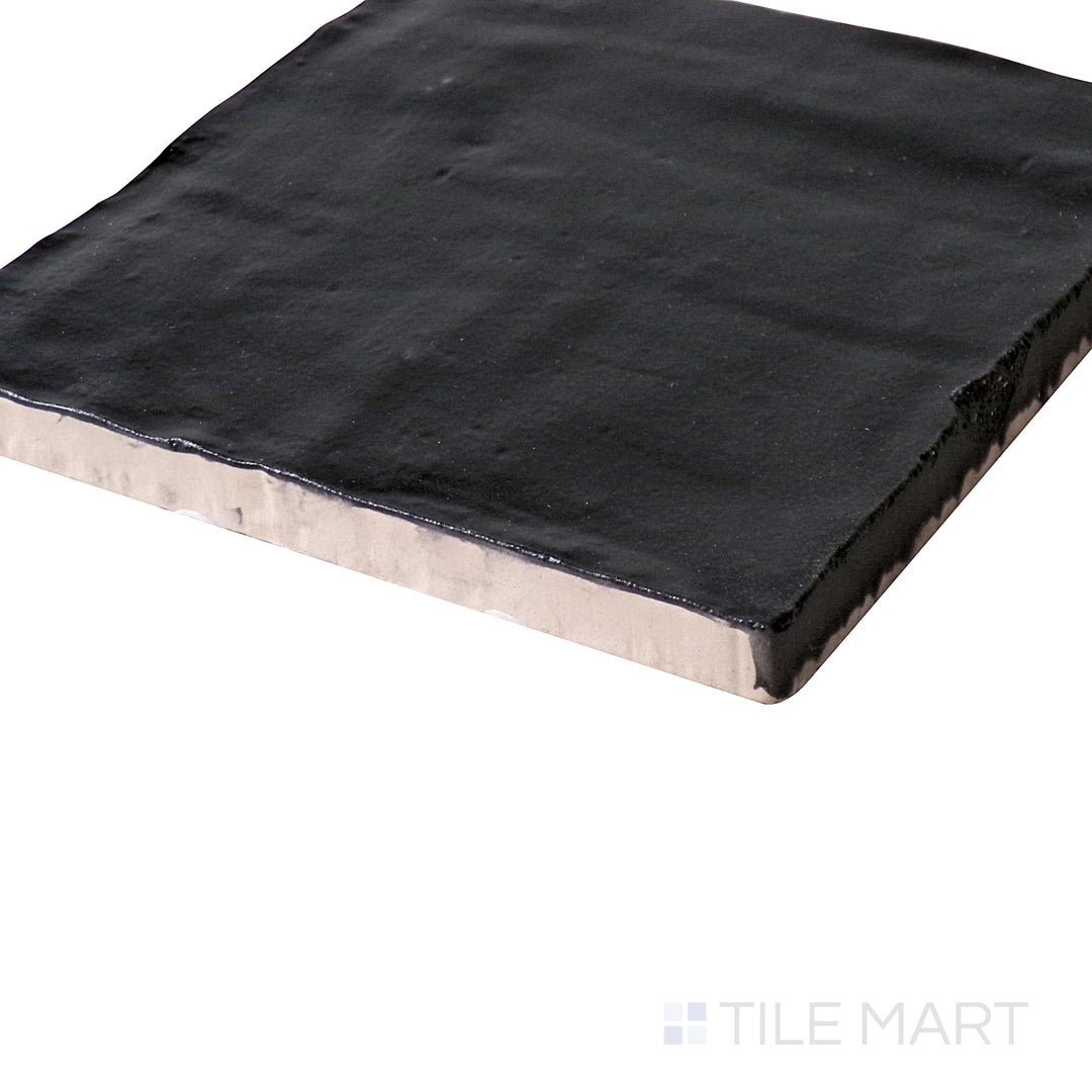 Low-angle perspective bringing out the deep black surface and subtle matte sheen of Mallorca Black 4X4 Matte Ceramic.
