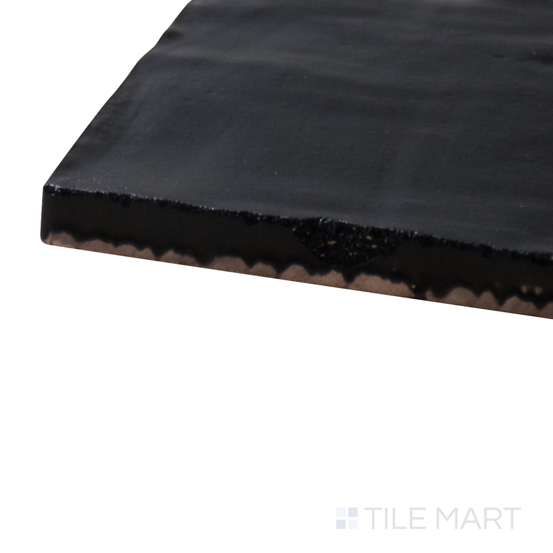 A corner shot of the Mallorca Black 4x4 matte ceramic tile highlights its bold black color and matte surface, perfect for creating depth and drama in any space.