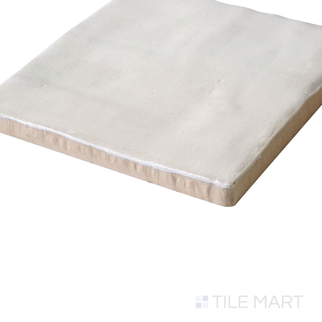 Tilted view enhancing the warm cream color and soft matte coating of Mallorca Cream 4X4 Matte Ceramic.
