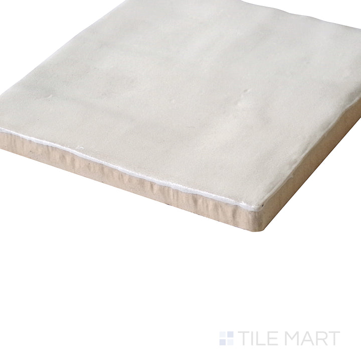 Tilted view enhancing the warm cream color and soft matte coating of Mallorca Cream 4X4 Matte Ceramic.