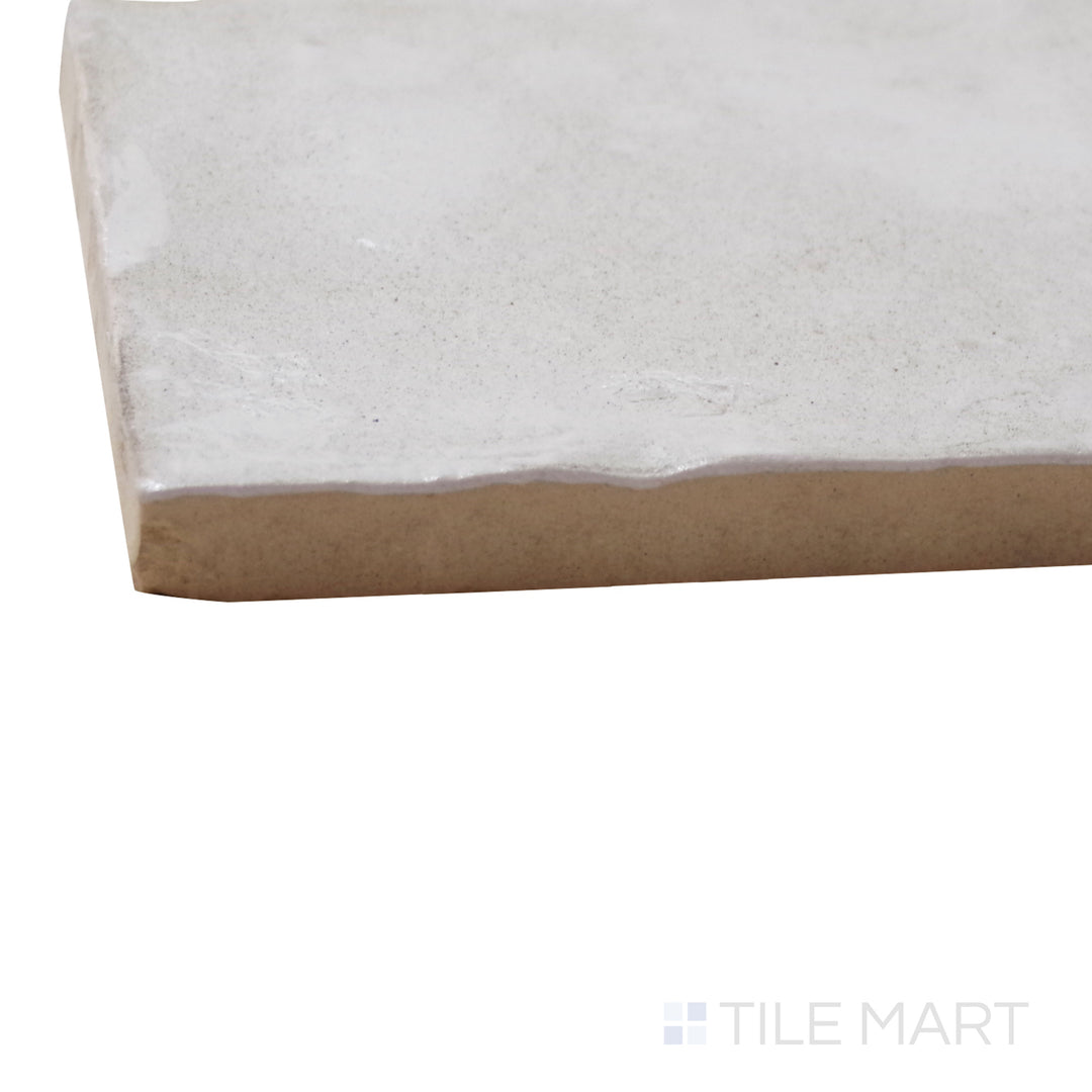 A corner perspective of the Mallorca Cream 4x4 matte ceramic tile emphasizes its warm cream tones and velvety matte texture, offering a classic and inviting aesthetic.