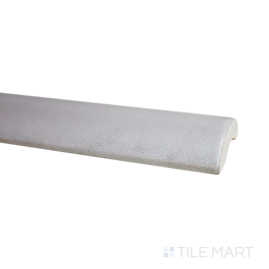 Slightly tilted view bringing out the cool grey shade and smooth matte texture of Mallorca Grey 1X8 Matte Ceramic Pencil.