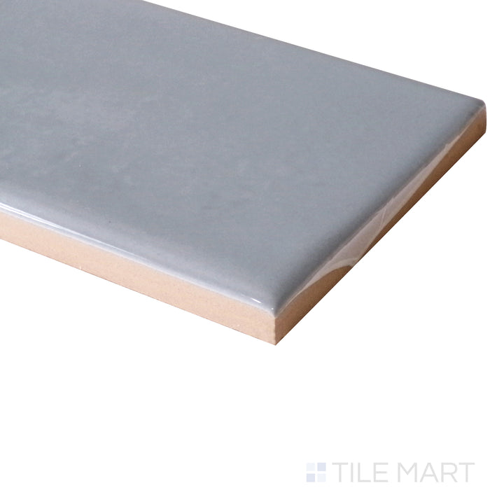 Tile shown from corner angle of Manhattan Ceramic 9th Ave 3x12 glossy tile revealing glossy finish and detailed edge