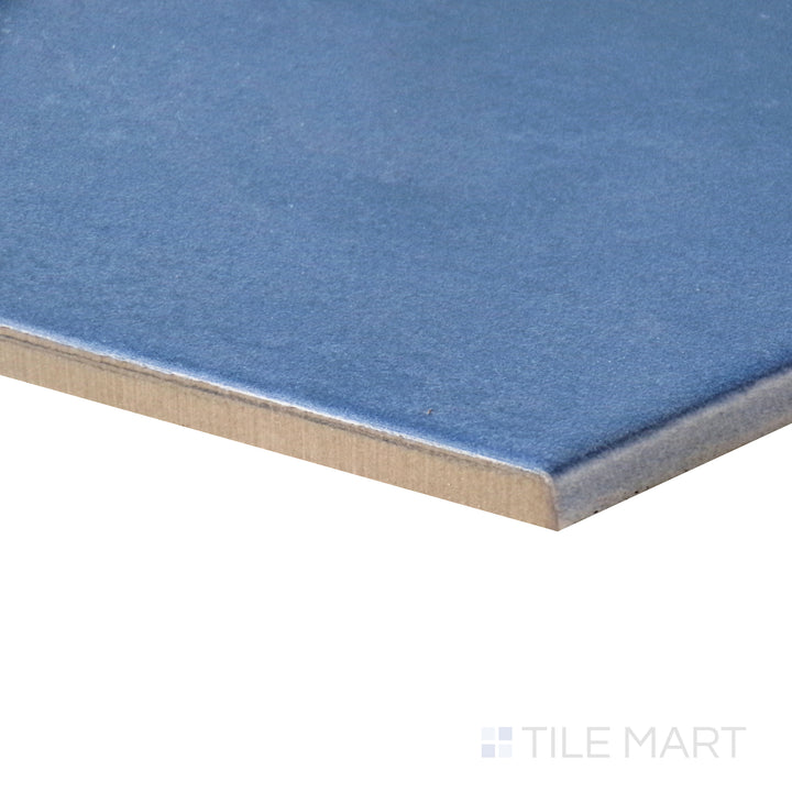 Angled view capturing the refreshing blue-green hue of Meraki Base Aguamarina 8" hexagon matte porcelain tile.