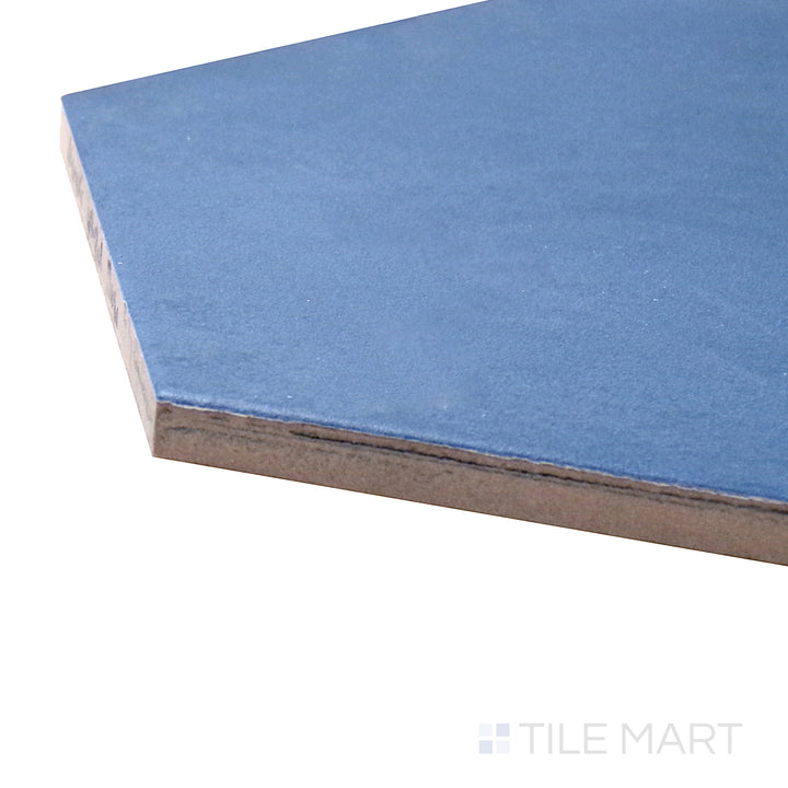 Captured from a corner angle, the Meraki Base Azul 8" hexagon matte porcelain tile showcases its rich blue tone and matte texture, creating a bold and stylish statement.
