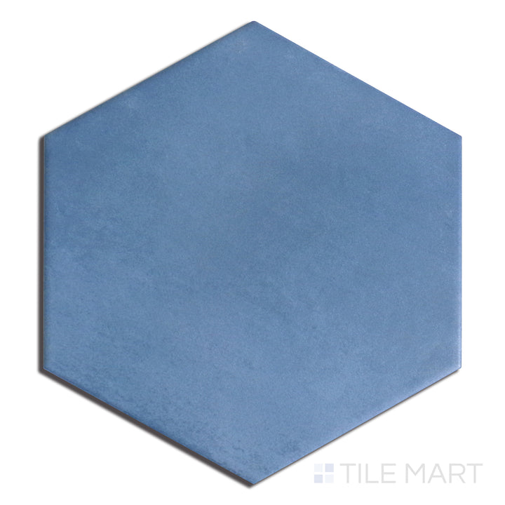 Overhead shot of Meraki Base Azul 8" Hexagon Matte Porcelain, showcasing a deep blue tone with a smooth matte surface for a bold design statement.