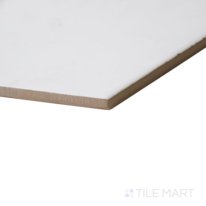 Angled close-up highlighting the crisp white surface of Meraki Base Blanco 8" hexagon matte porcelain tile.