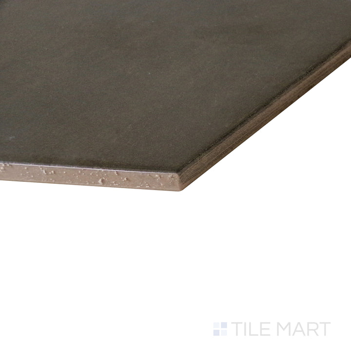 Dynamic perspective showcasing the deep black finish of Meraki Base Negro 8" hexagon matte porcelain tile.