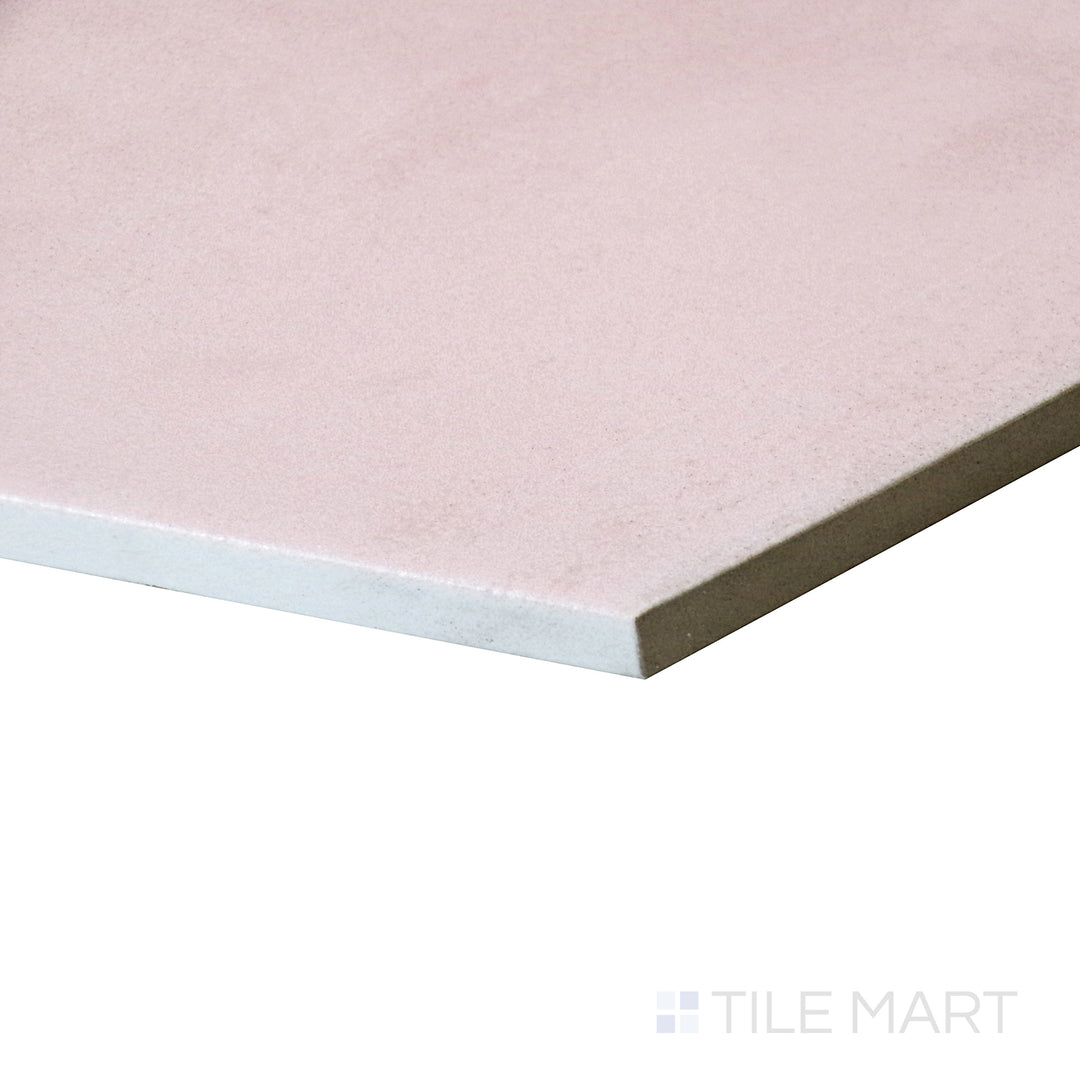 Angled view emphasizing the delicate blush tone of Meraki Base Rosa 8" hexagon matte porcelain tile.