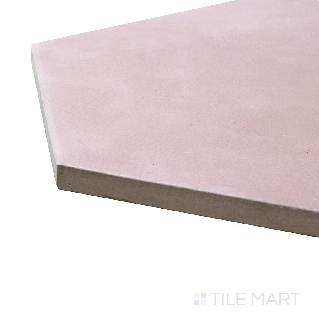 A corner shot of the Meraki Base Rosa 8" hexagon matte porcelain tile highlights its soft pink hue and matte surface, bringing a delicate yet modern charm.