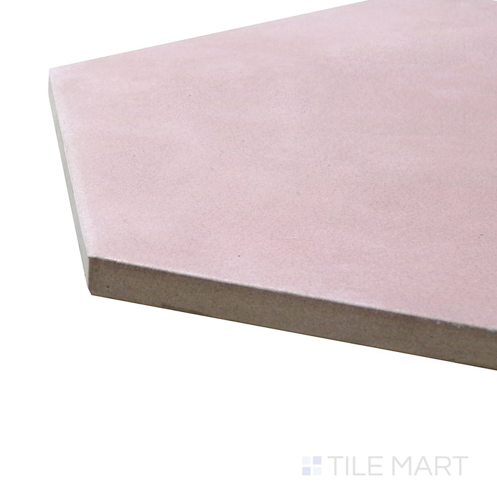 A corner shot of the Meraki Base Rosa 8" hexagon matte porcelain tile highlights its soft pink hue and matte surface, bringing a delicate yet modern charm.