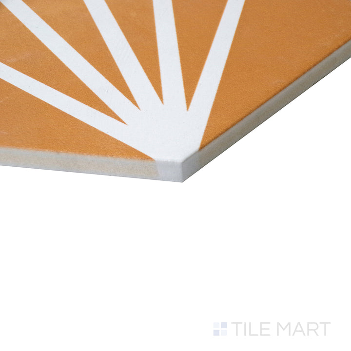 Angled close-up emphasizing the golden accent of Meraki Even Deco Mostaza 8" hexagon matte porcelain tile.