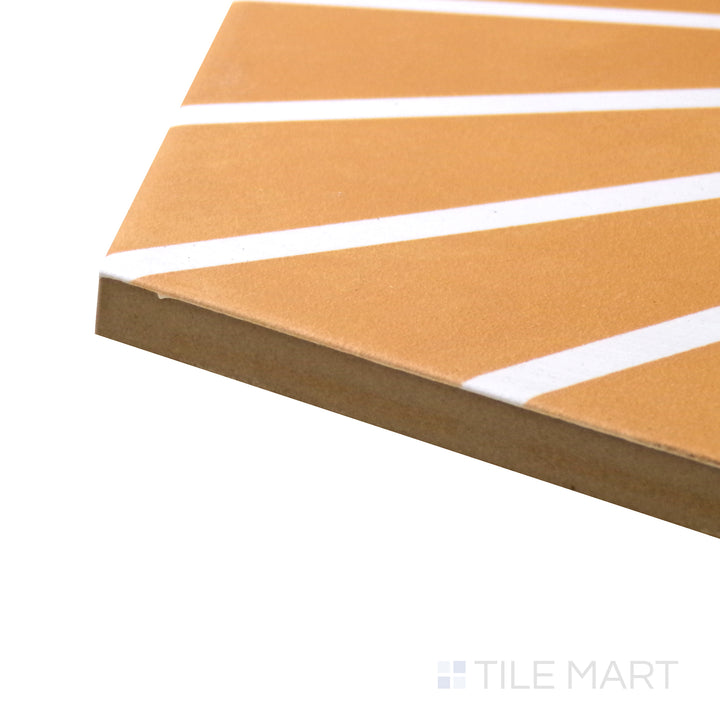 A corner shot of the Meraki Even Deco Mostaza 8" hexagon matte porcelain tile highlights its mustard yellow shade and artistic pattern, perfect for adding warmth and character.