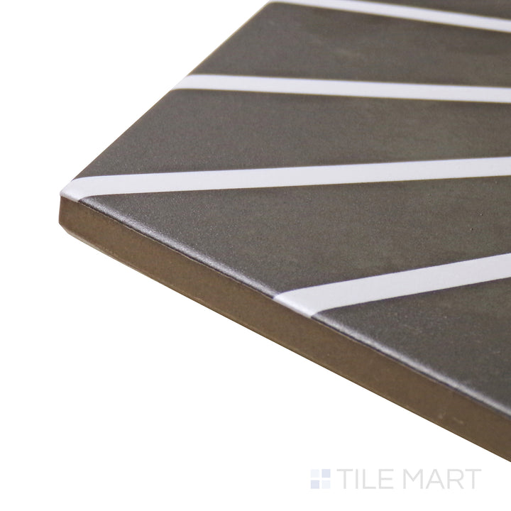 Captured from a corner angle, the Meraki Even Deco Negro 8" hexagon matte porcelain tile showcases its bold black pattern and hexagonal form, offering a dramatic and eye-catching look.