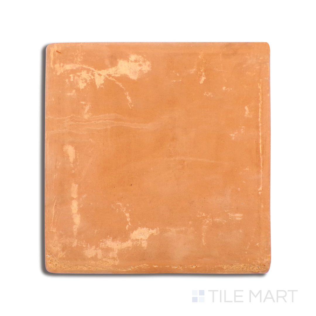 Top-down shot of Lincoln Pavers Red 12X12 Stair Coping Natural Terracotta, designed with a smooth, curved edge for seamless step transitions.