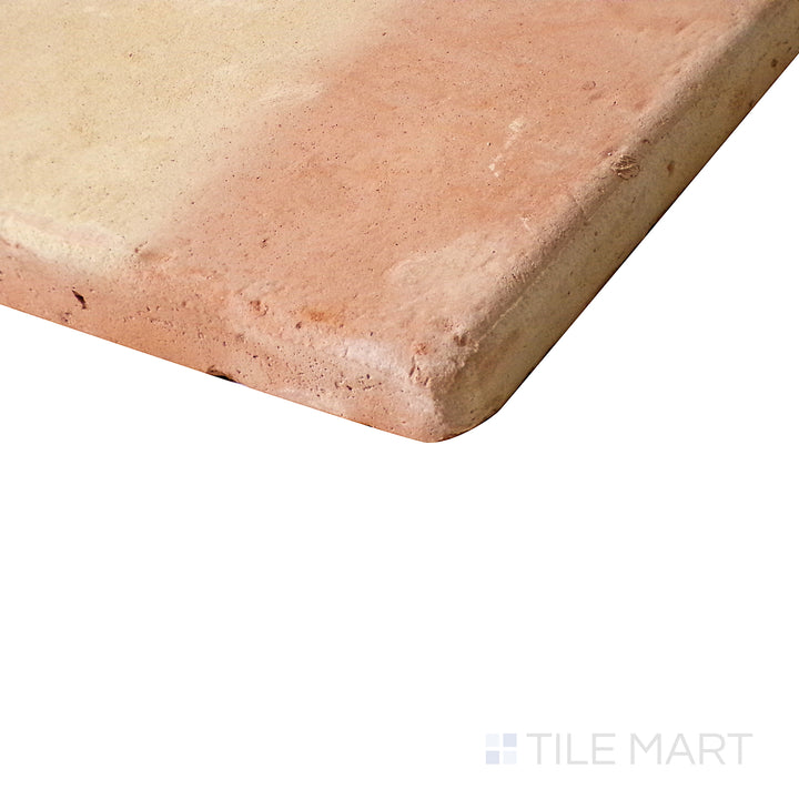 Tilted close-up capturing the soft, smooth curves of Saltillo Salmon 8X8 round edge natural terracotta tile.