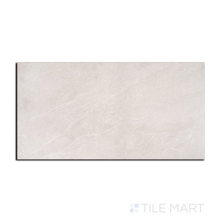 Flat lay of Nordika Sand 24X48 Matte Porcelain, displaying its warm sandy hues and subtle texture for a natural stone effect.