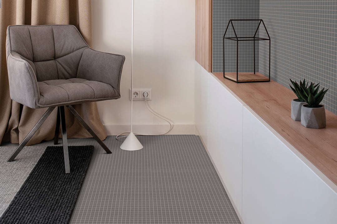 A stylish and neutral-toned space featuring Natureglass Malla Grey 1" square matte glass mosaic, offering subtle texture and modern appeal.