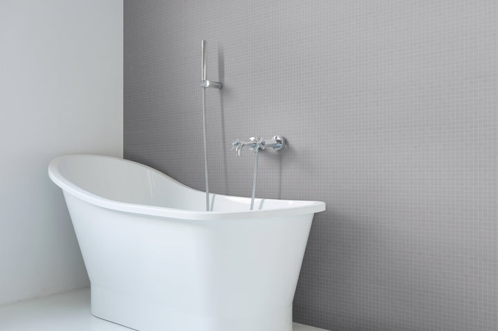 A refined and soft-toned interior showcasing Natureglass Malla Smooth Grey 1" square matte glass mosaic, blending effortlessly for a minimalist design.