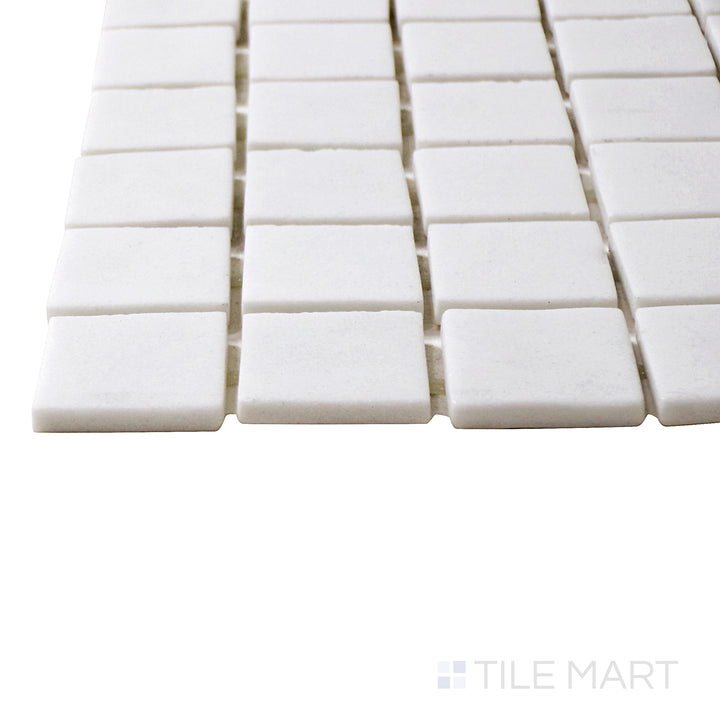 A corner perspective of the Natureglass Malla White 1" square matte glass mosaic tile emphasizes its crisp white shade and matte finish, offering a clean and modern aesthetic.