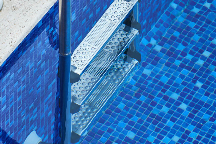 A cool and elegant atmosphere with Nieve Marino 1" square glossy glass mosaic, enhancing spaces with deep blue tones and polished sophistication.