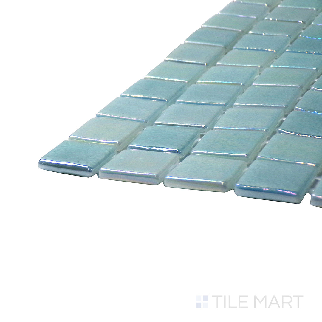 A corner perspective of the Opalescent Claro Verde 1" square glossy glass mosaic tile emphasizes its fresh green tones and luminous glossy surface, ideal for adding a natural touch to interiors.