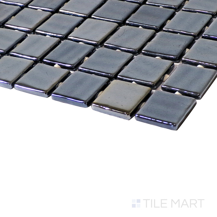 A striking angle shot showcasing the sleek Opalo Negro 1" square glossy glass mosaic, capturing depth, shine, and intricate detailing.
