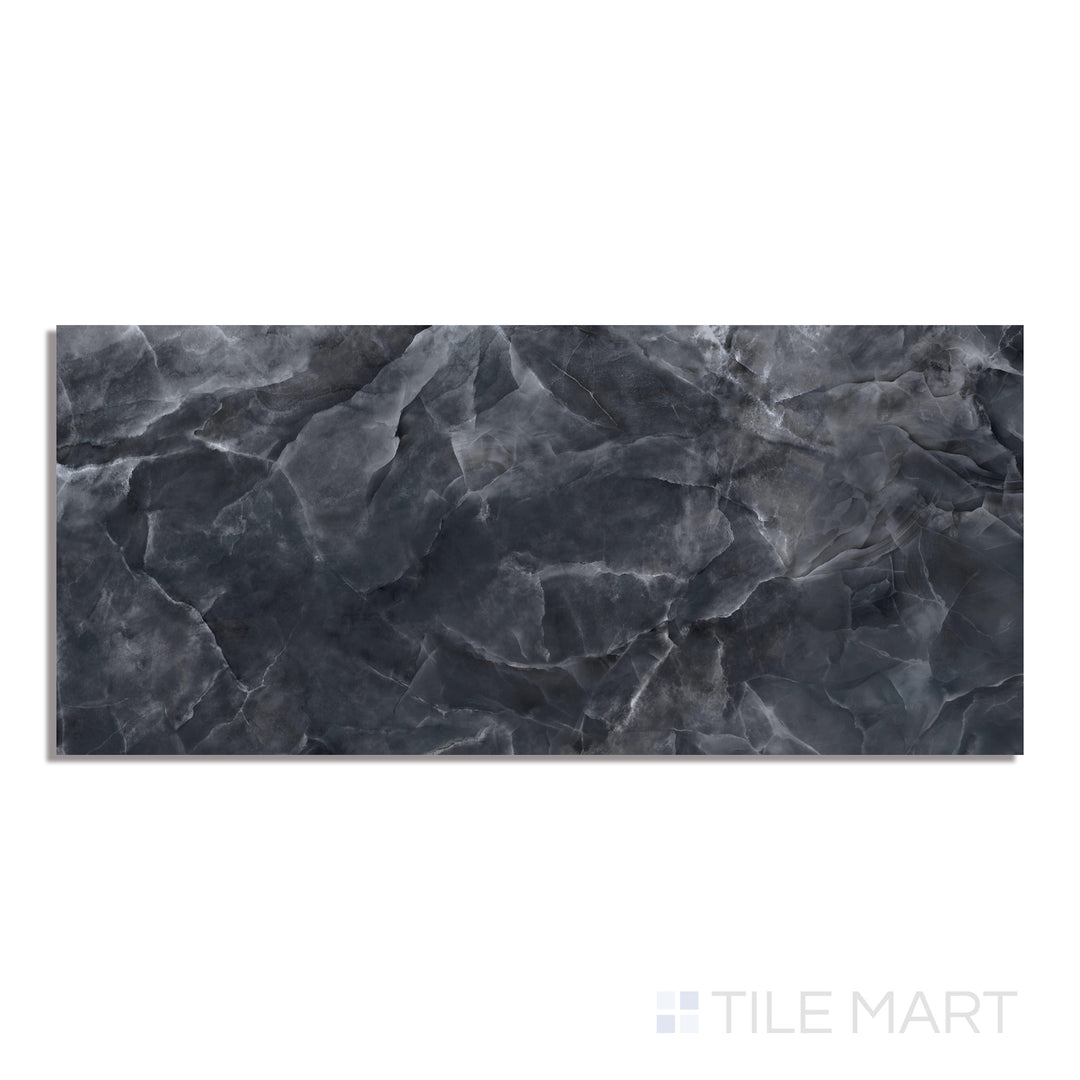 A sleek black polished porcelain slab in a 24x48 size, reflecting light beautifully in this top-down view, showcasing its deep, glossy surface.