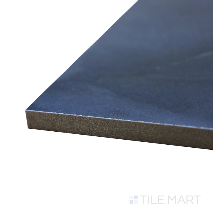 Captured from a corner angle, the Onyx Blue 24x48 polished porcelain tile showcases its striking blue veining and high-gloss surface, perfect for adding a touch of sophistication.