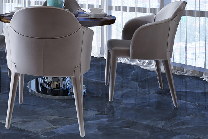 A bold and captivating atmosphere with Onyx Blue 24X48 polished porcelain, combining rich blue hues with a smooth, reflective surface.