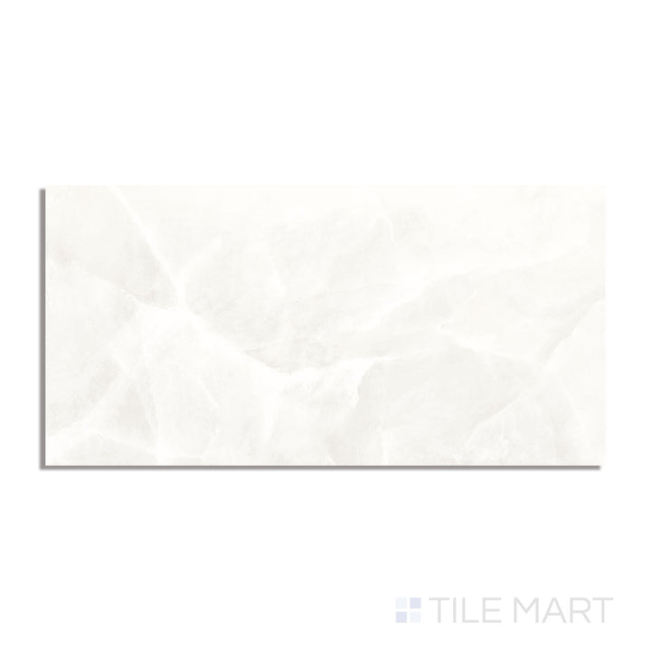 A pristine white onyx-inspired polished porcelain tile, measuring 24x48 inches, displayed from above to highlight its reflective surface and subtle veining.