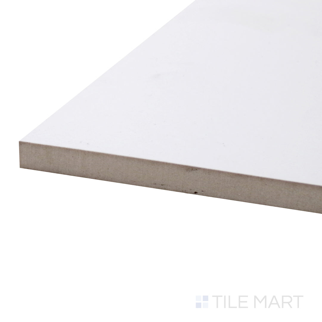 A corner shot of the Pearl Super White 48x48 matte porcelain tile highlights its expansive size and pure white tone, enhancing any space with a minimalist and luxurious appeal.