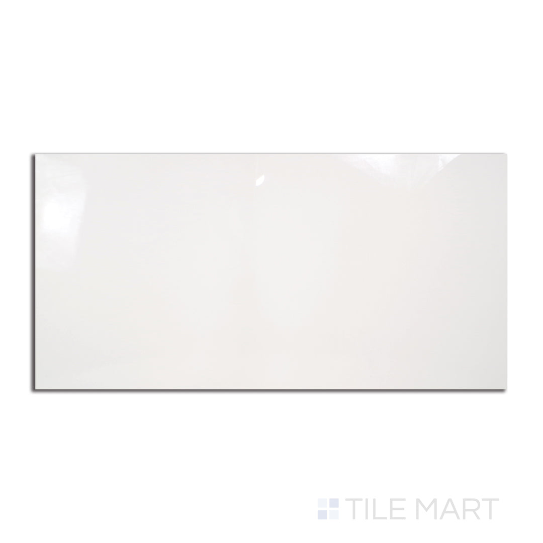 A glossy 12x24 polished porcelain tile in a pure white hue, arranged in a rectangular format, viewed from above to highlight its reflective sheen.