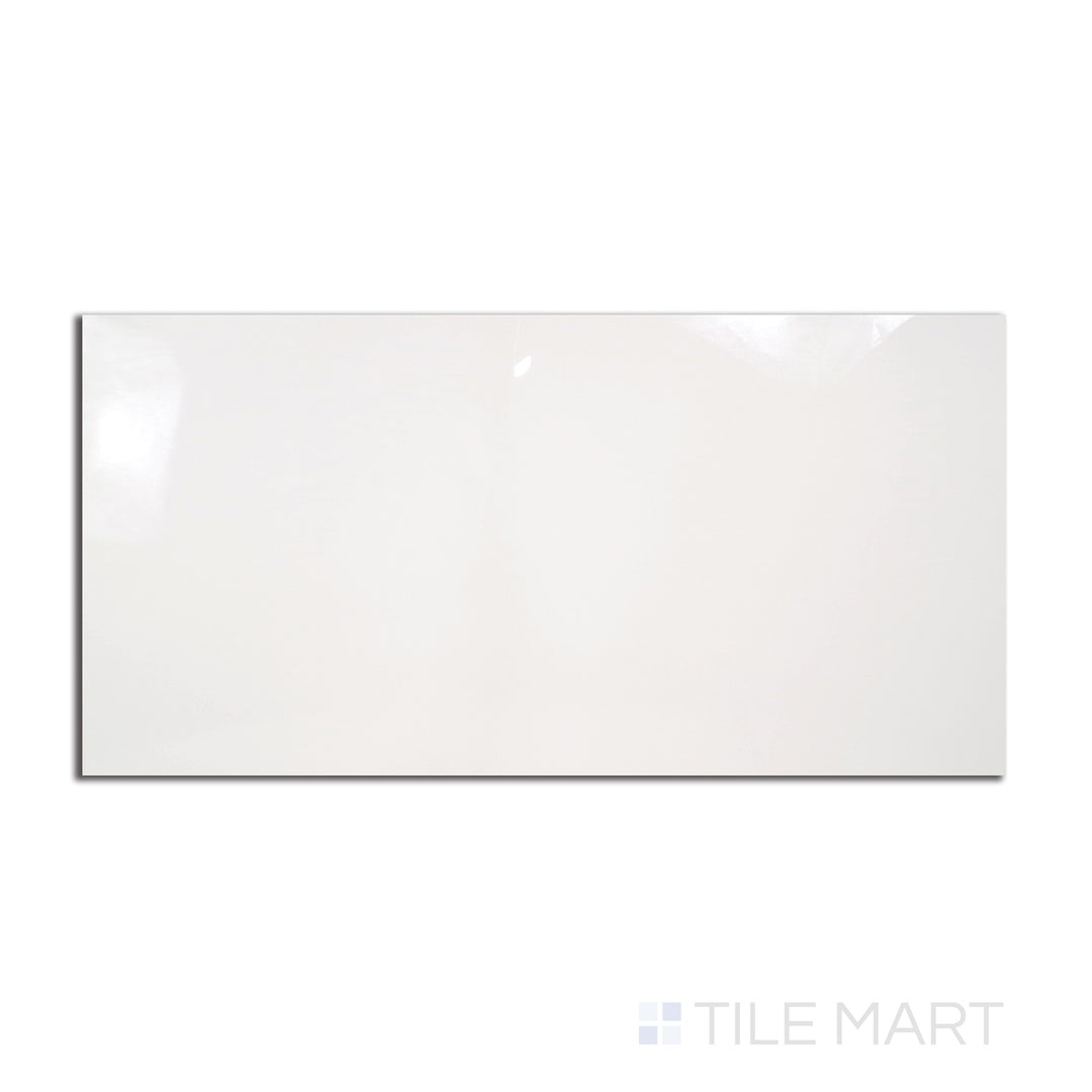 A large, glossy 24x48 porcelain tile in a striking Pearl Super White shade, captured from a top-down angle to showcase its mirror-like polish.