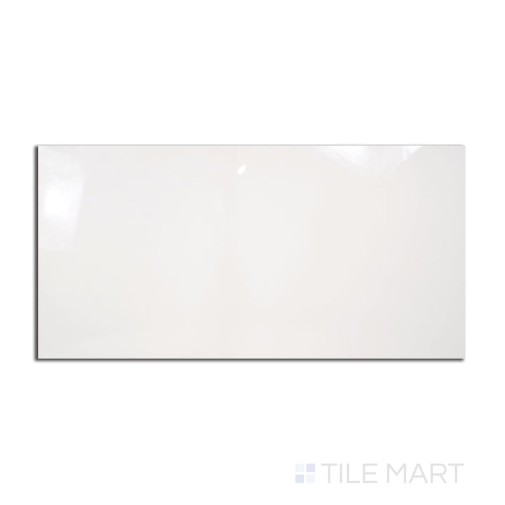 A large, glossy 24x48 porcelain tile in a striking Pearl Super White shade, captured from a top-down angle to showcase its mirror-like polish.