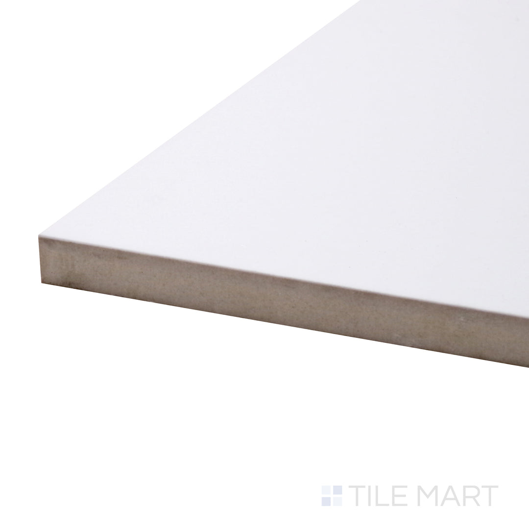 A corner shot of the Pearl Super White 48x48 polished porcelain tile highlights its luminous finish and grand format, adding a sophisticated and upscale look to any space.