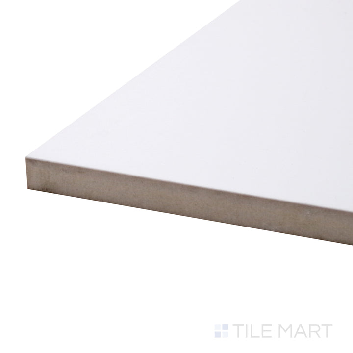 A corner shot of the Pearl Super White 48x48 polished porcelain tile highlights its luminous finish and grand format, adding a sophisticated and upscale look to any space.