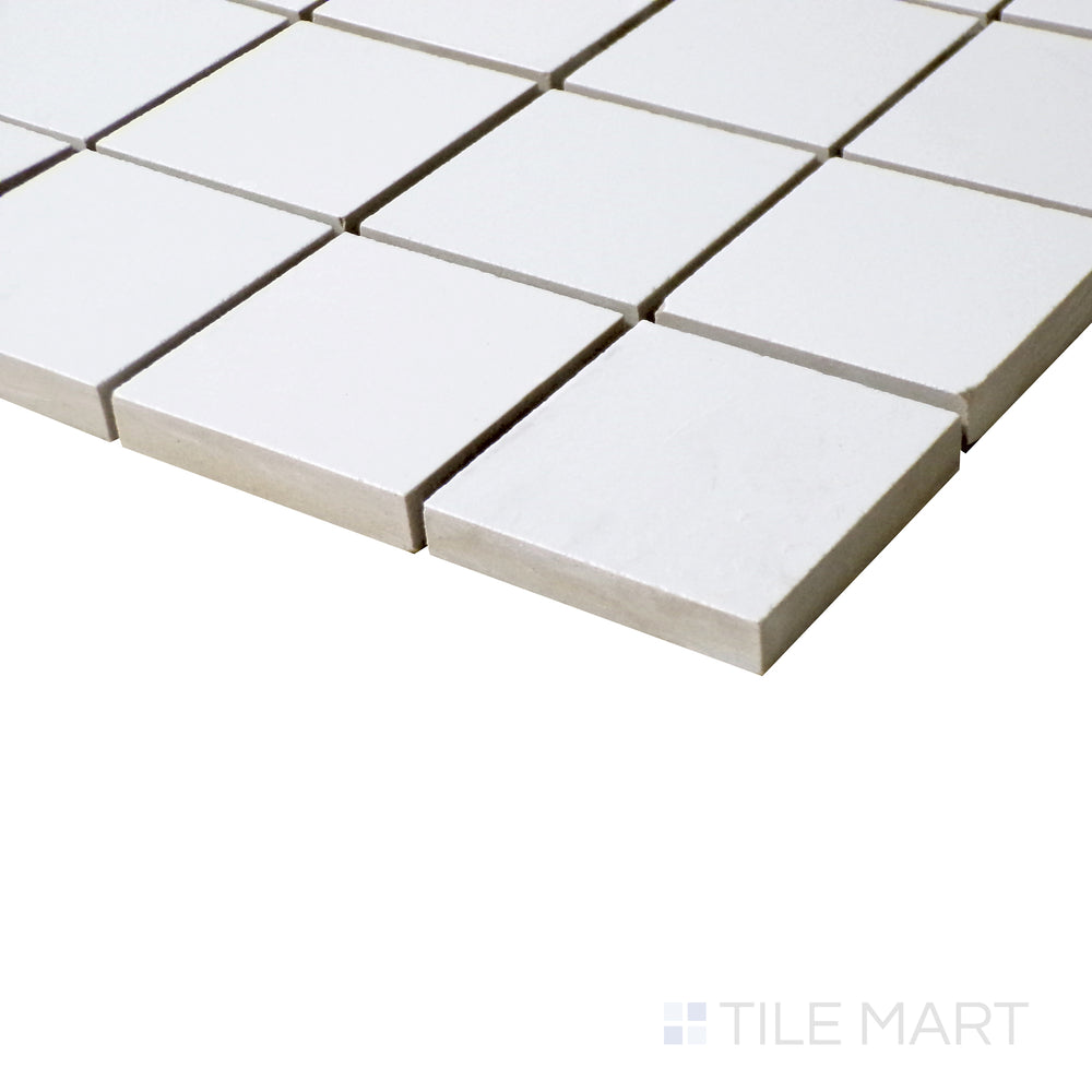 Angled close-up showcasing the subtle matte texture of Pearl Super White 2